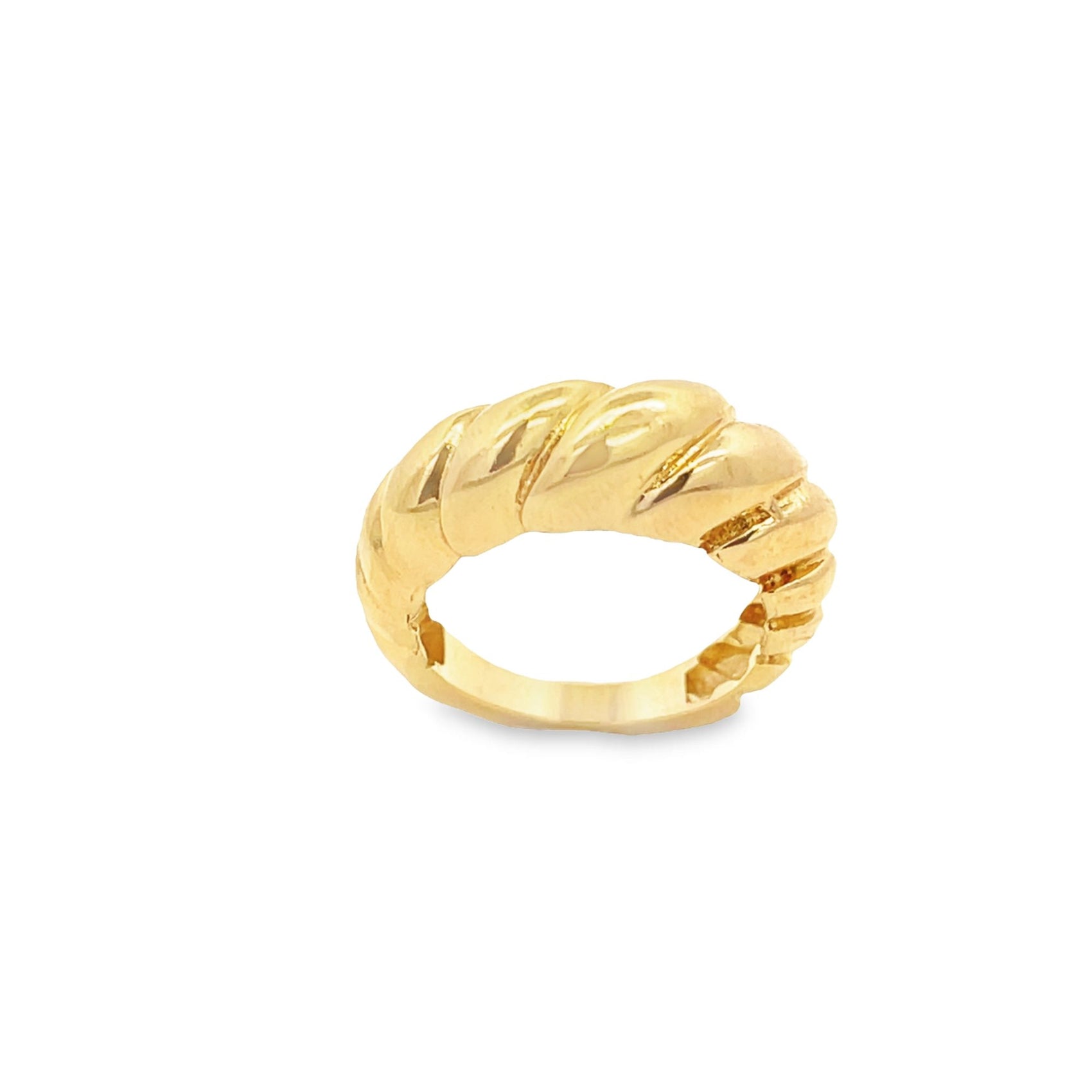 A shiny gold croissant dome ring rests against a plain white background.