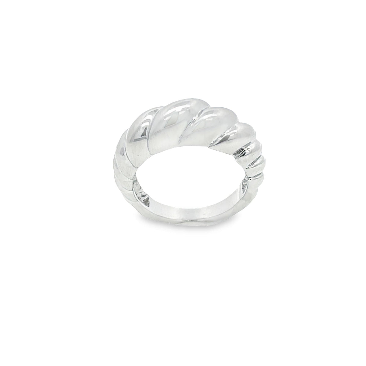A polished silver croissant dome ring sits against a plain white background.