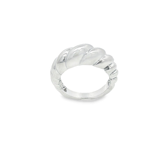 A polished silver croissant dome ring sits against a plain white background.