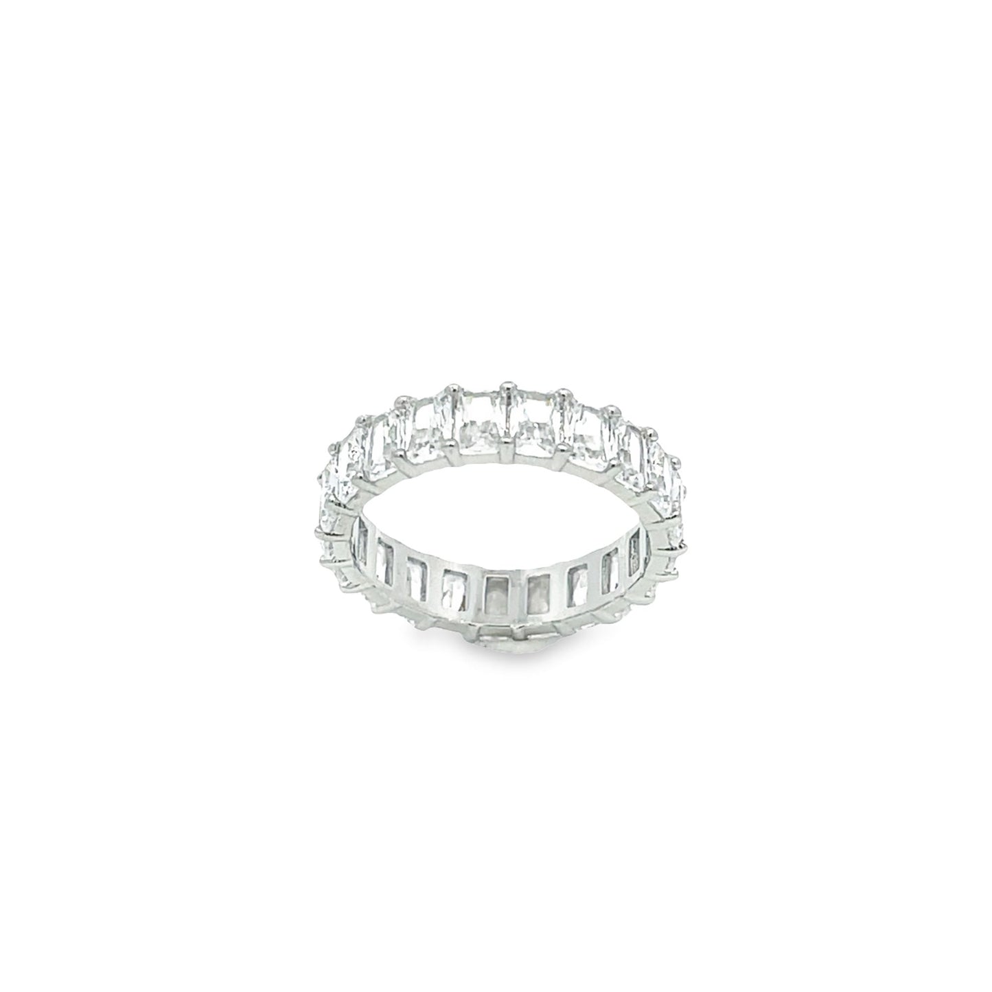A sparkling emerald-cut diamond eternity band rests against a clean white background.
