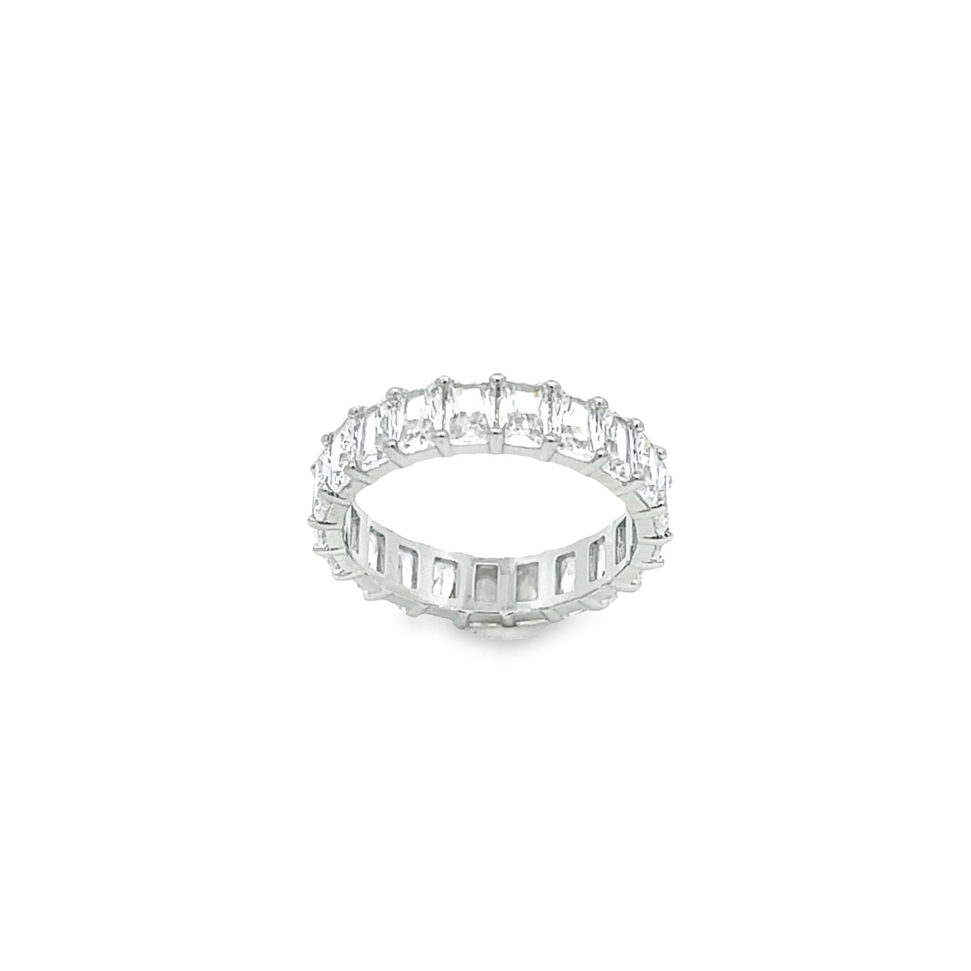 A sparkling emerald-cut diamond eternity band rests against a clean white background.