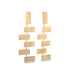 A pair of dangling gold geometric earrings features a cascading design of interconnected rectangular metal links.