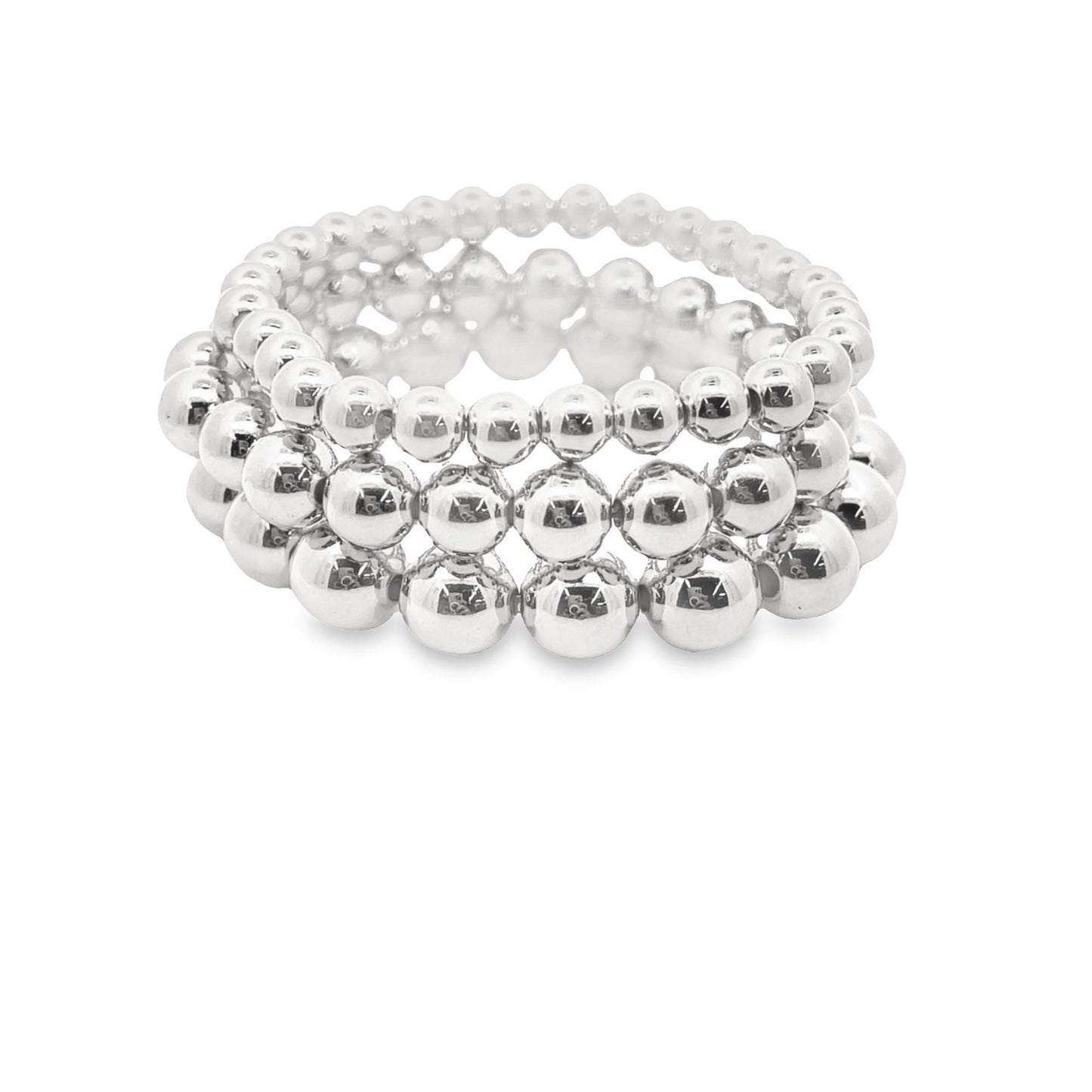 A stack of three shiny silver ball bead stretch bracelets sits on a clean white background.