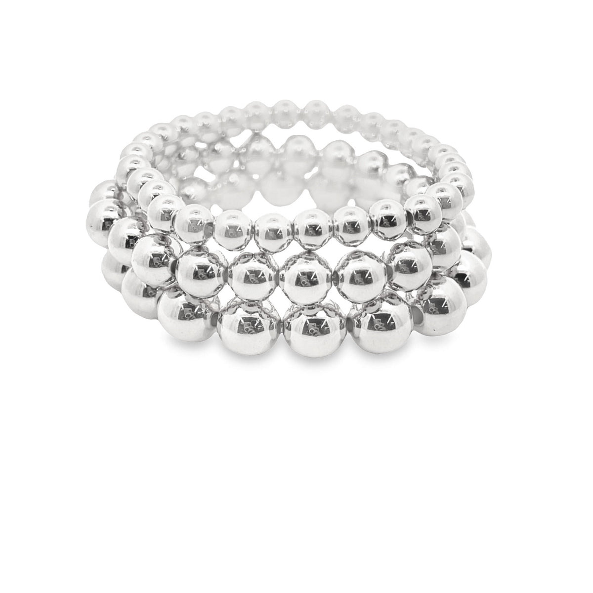 A stack of three shiny silver ball bead stretch bracelets sits on a clean white background.