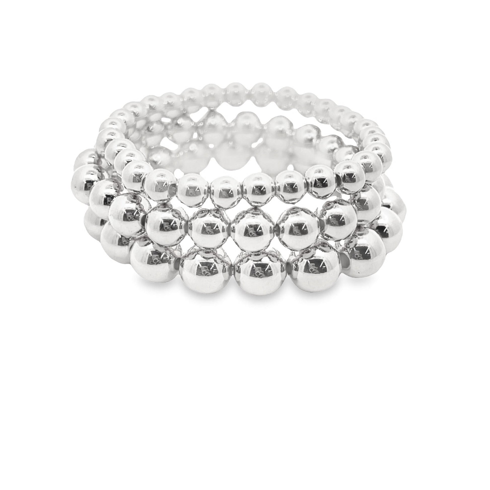 A stack of three shiny silver ball bead stretch bracelets sits on a clean white background.