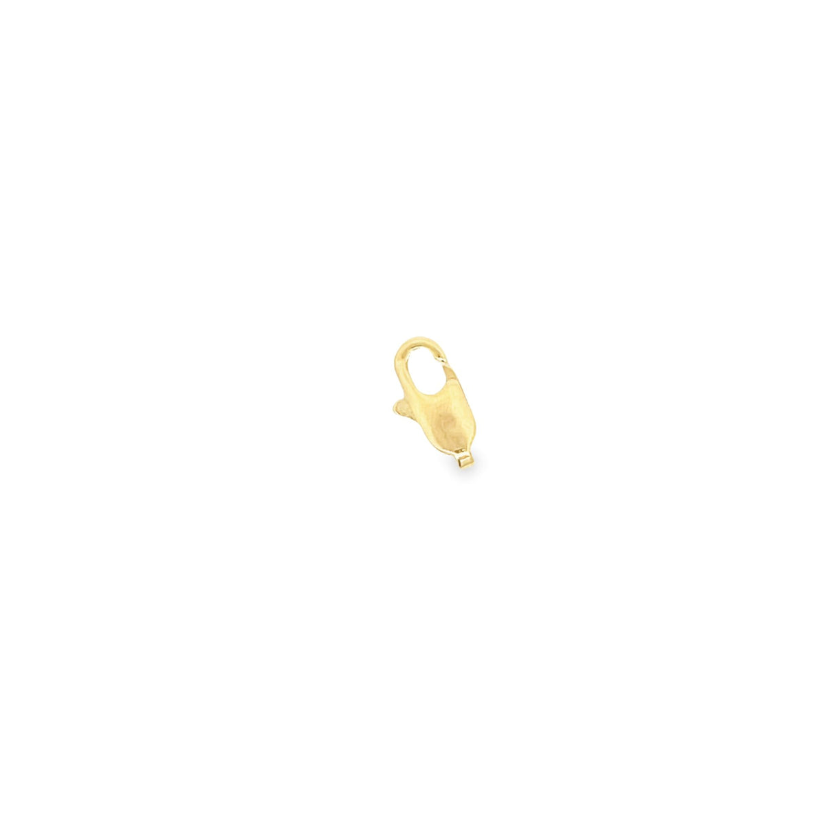 A polished gold lobster claw clasp rests against a clean white background.