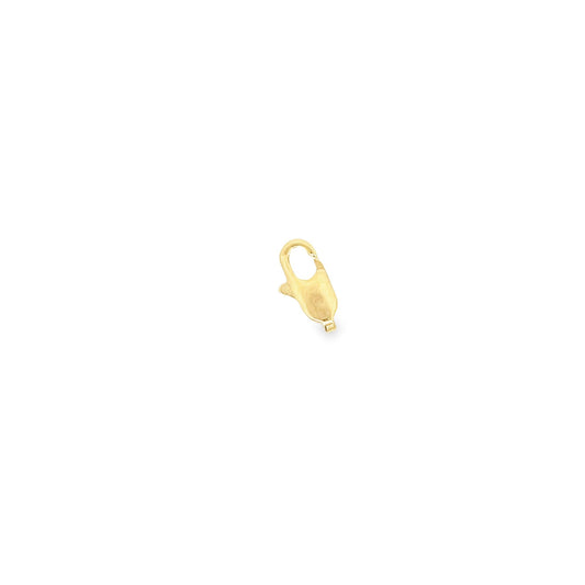 A polished gold lobster claw clasp rests against a clean white background.