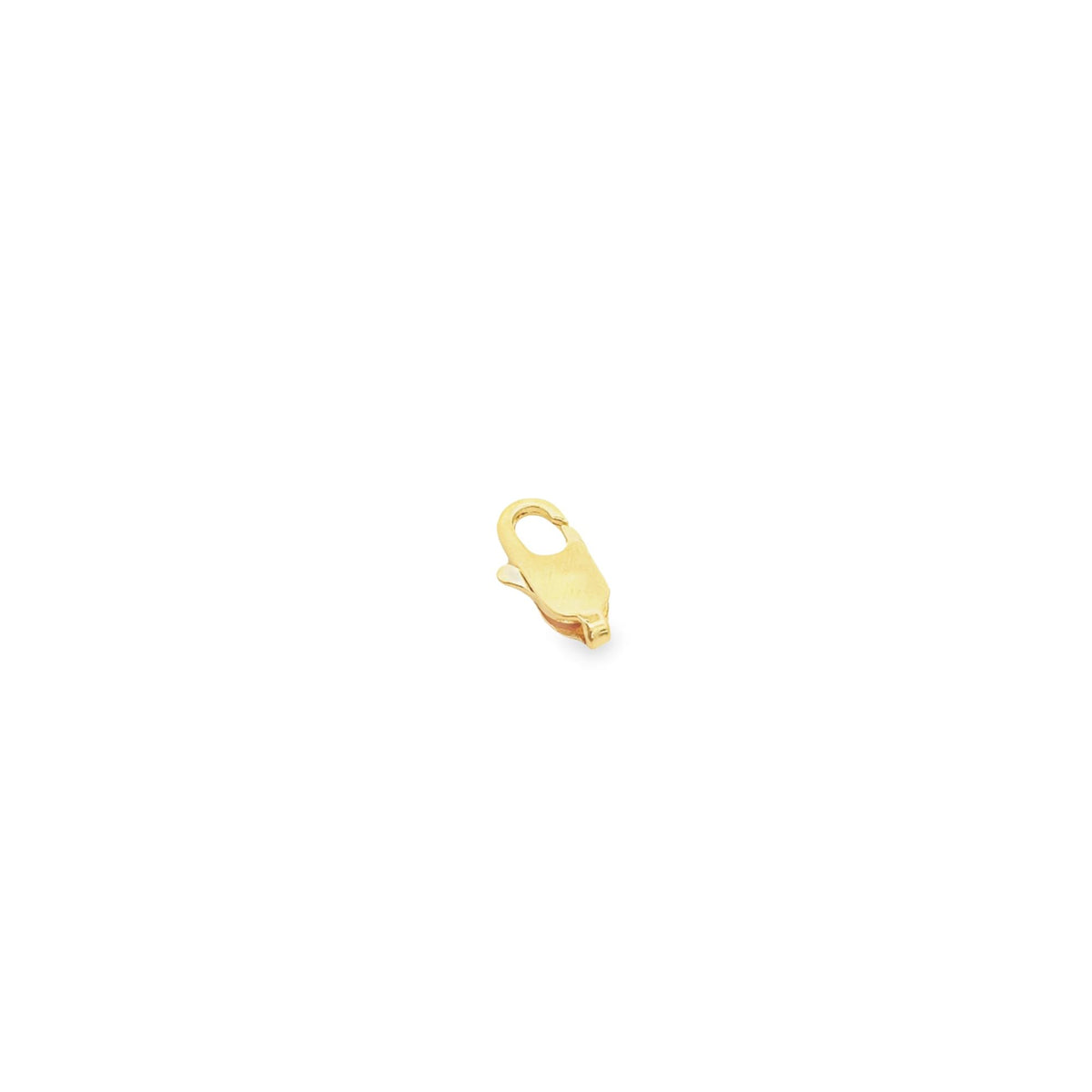 A small, polished gold lobster claw clasp rests against a clean white background.