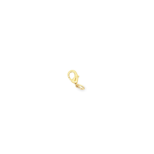A polished yellow gold lobster claw clasp rests against a clean white background.