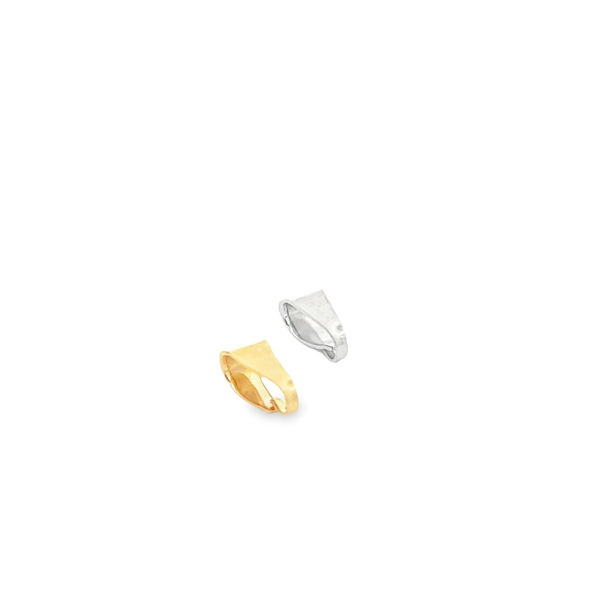 A gold bail and a silver bail pendant connector lie diagonally against a white background.