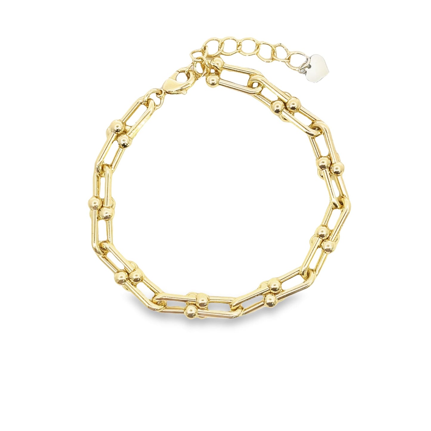 A gold link bracelet featuring interlocking elongated paperclip links and small decorative spheres is displayed against a white background.