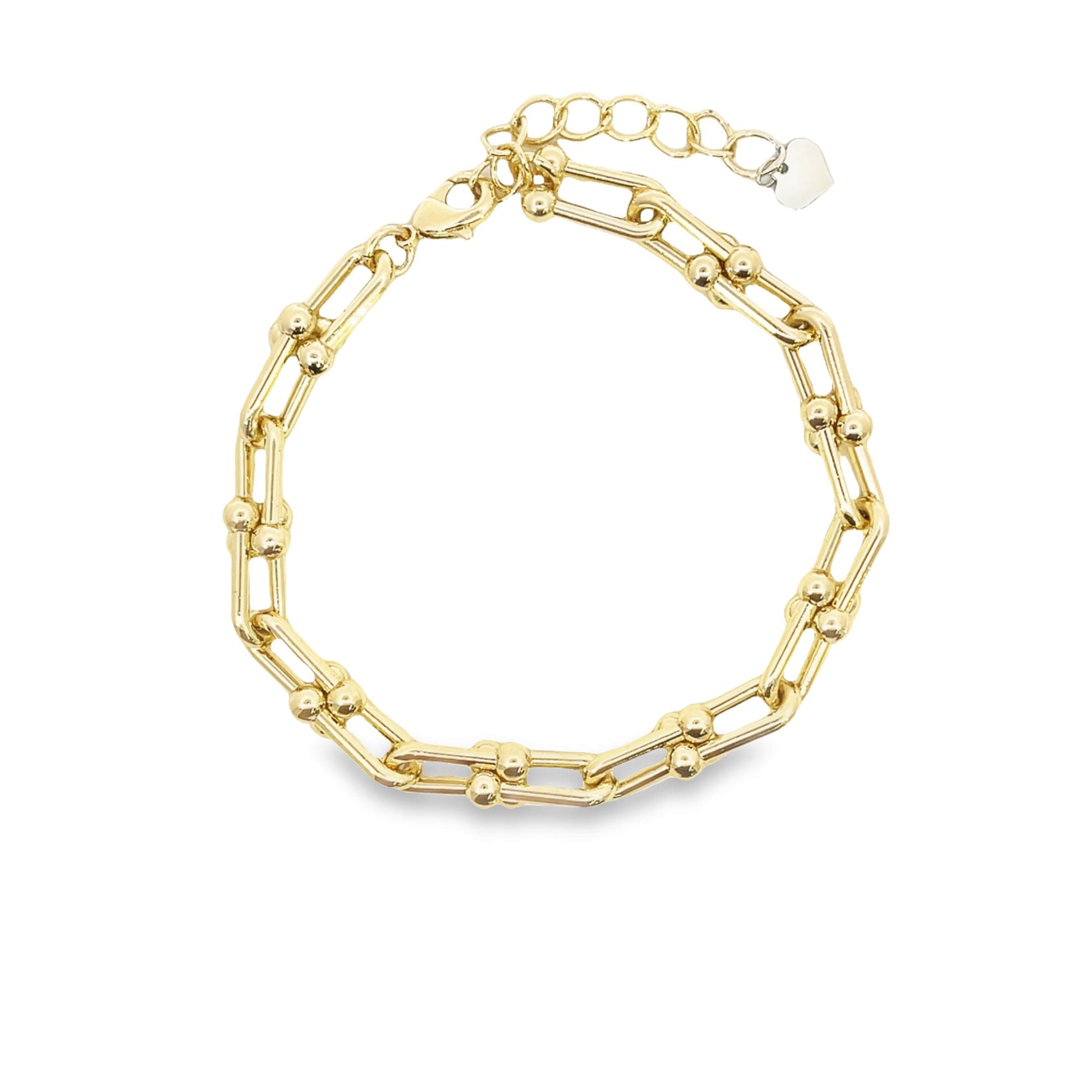 A gold link bracelet featuring interlocking elongated paperclip links and small decorative spheres is displayed against a white background.