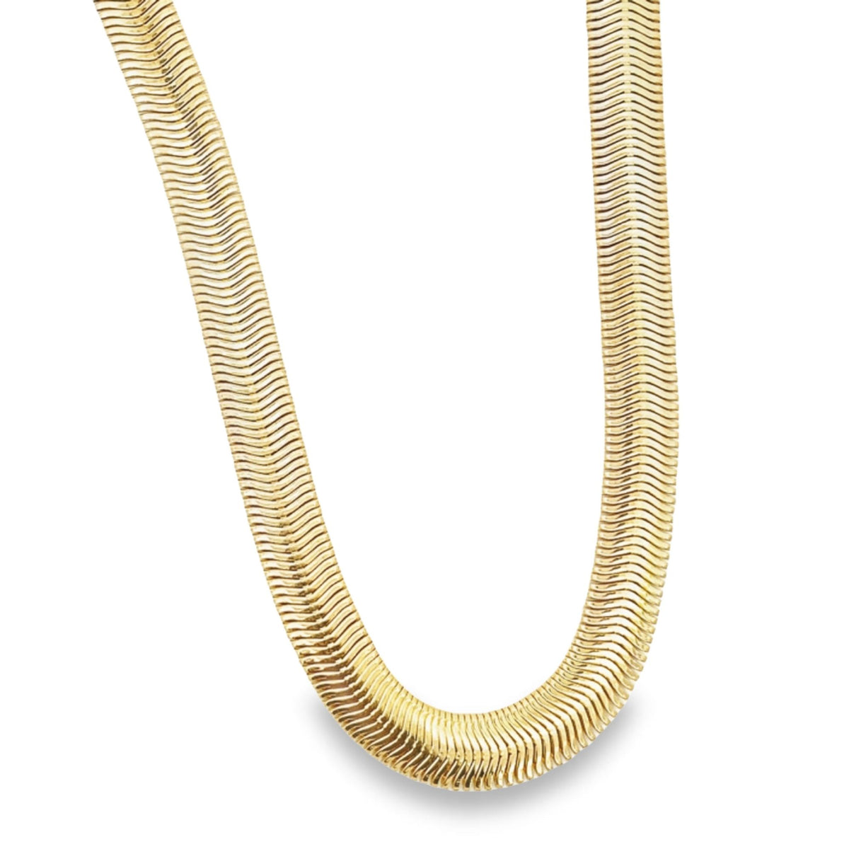 A polished gold herringbone chain necklace curves gracefully against a plain white background.