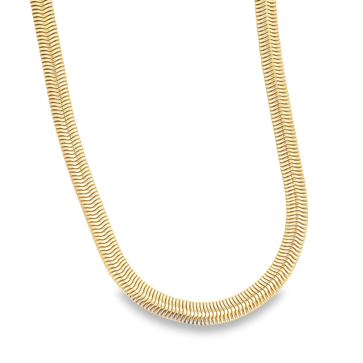 A thick, flat gold herringbone chain necklace curves gracefully against a clean white background.
