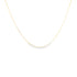 A delicate yellow gold box chain necklace drapes against a white background.