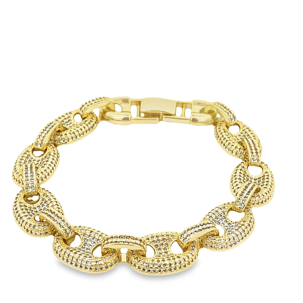 A thick gold chain bracelet sparkles with pavé-set diamonds on a white background.