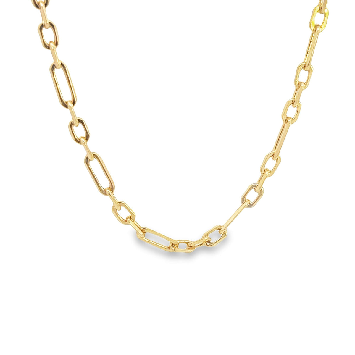 A shiny gold paperclip chain necklace rests gracefully in a gentle curve against a plain white background.
