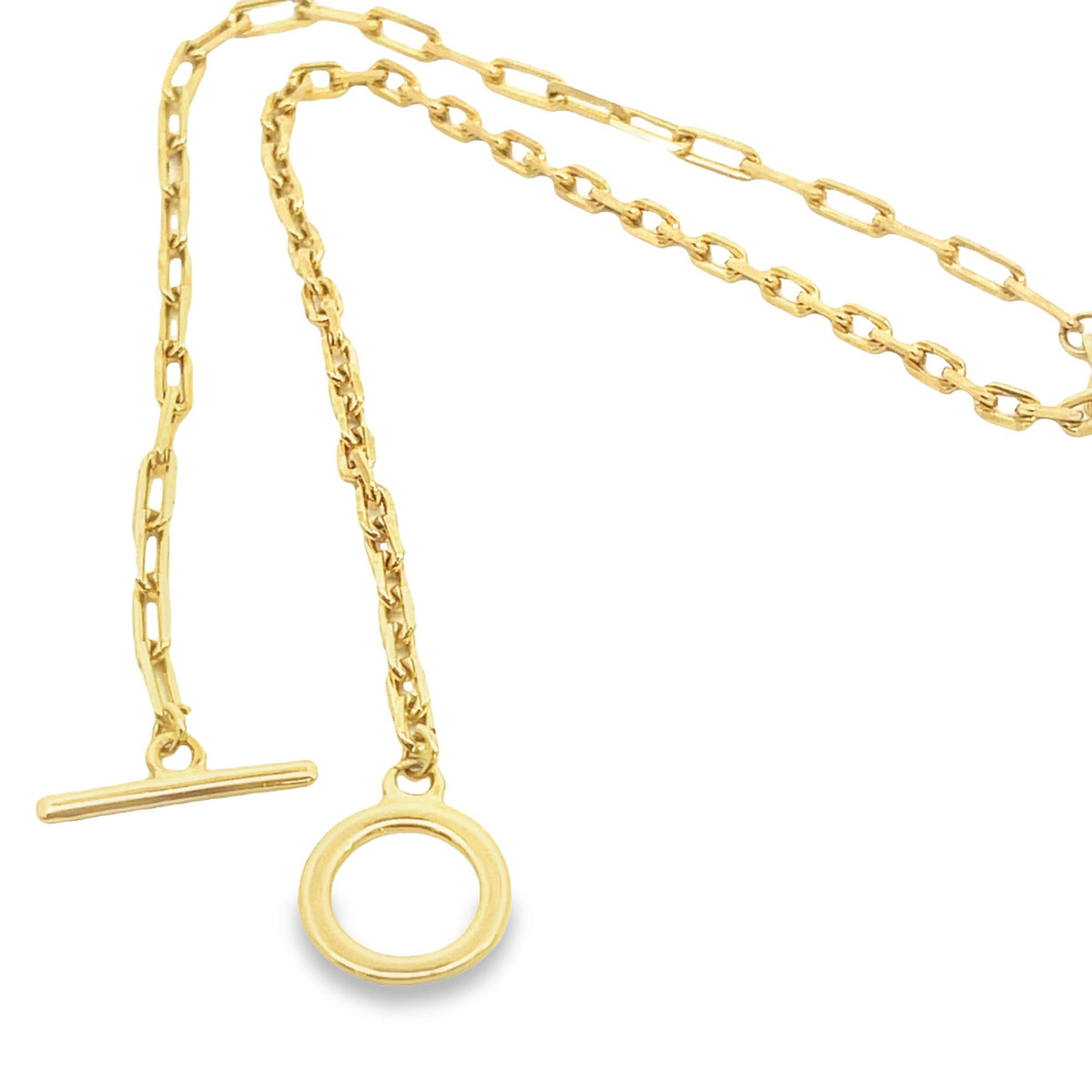 A delicate gold paperclip chain necklace features a classic toggle clasp with a T-bar and ring closure.