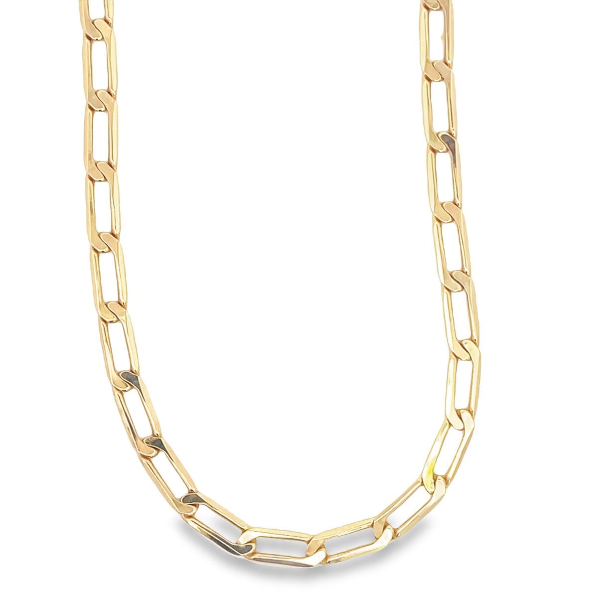 A thick gold paperclip chain necklace rests against a clean white background.