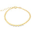 A delicate gold chain bracelet features small, flat, disc-shaped links and an adjustable extension chain against a white background.