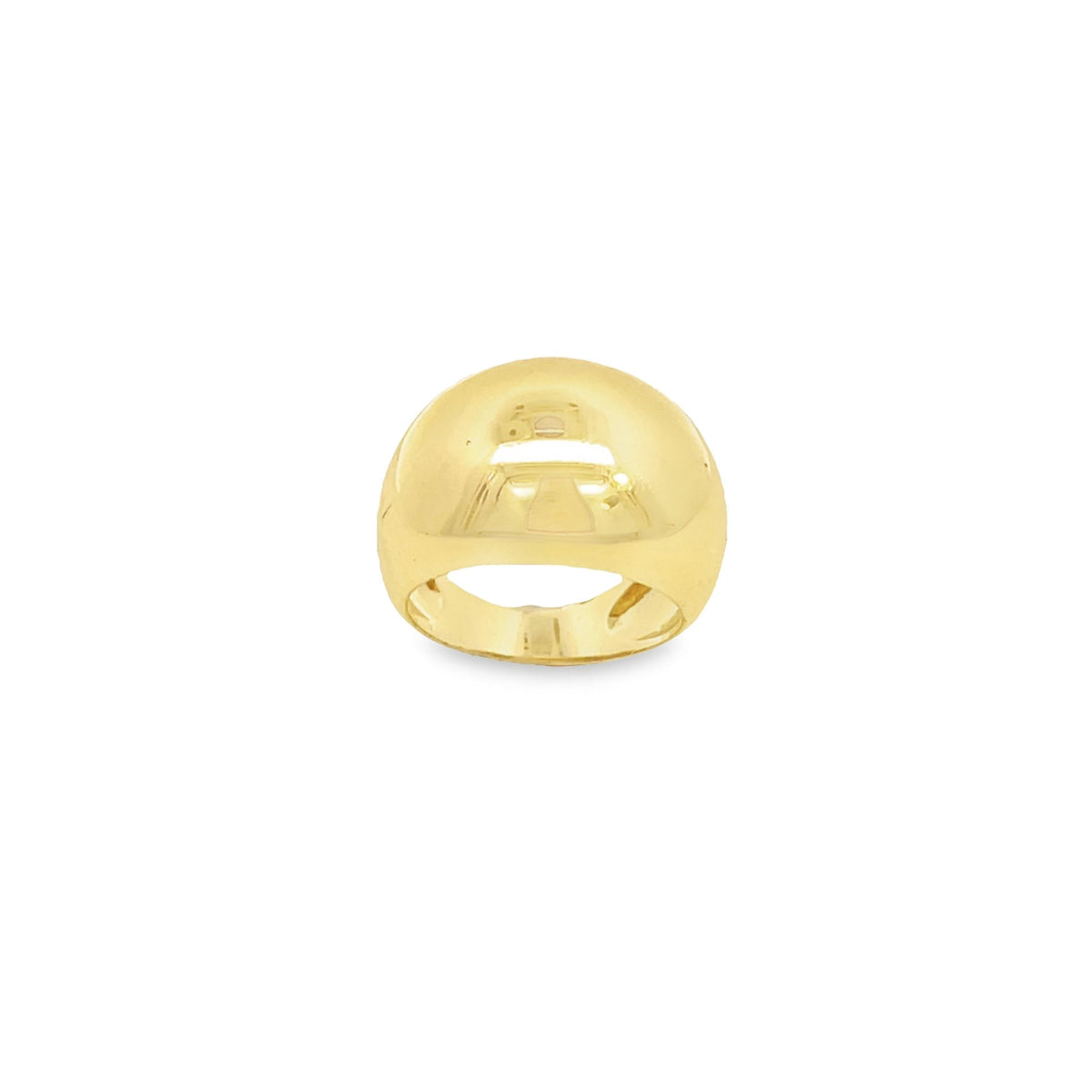 A polished yellow gold dome ring rests against a clean white background.