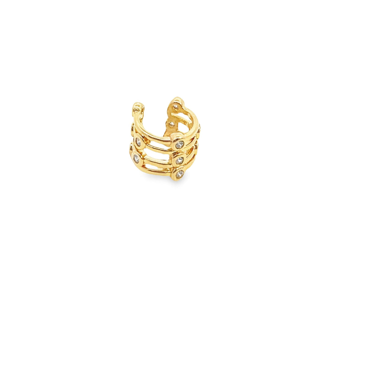 A multi-band gold ear cuff sparkling with tiny inlaid diamonds rests against a clean white background.