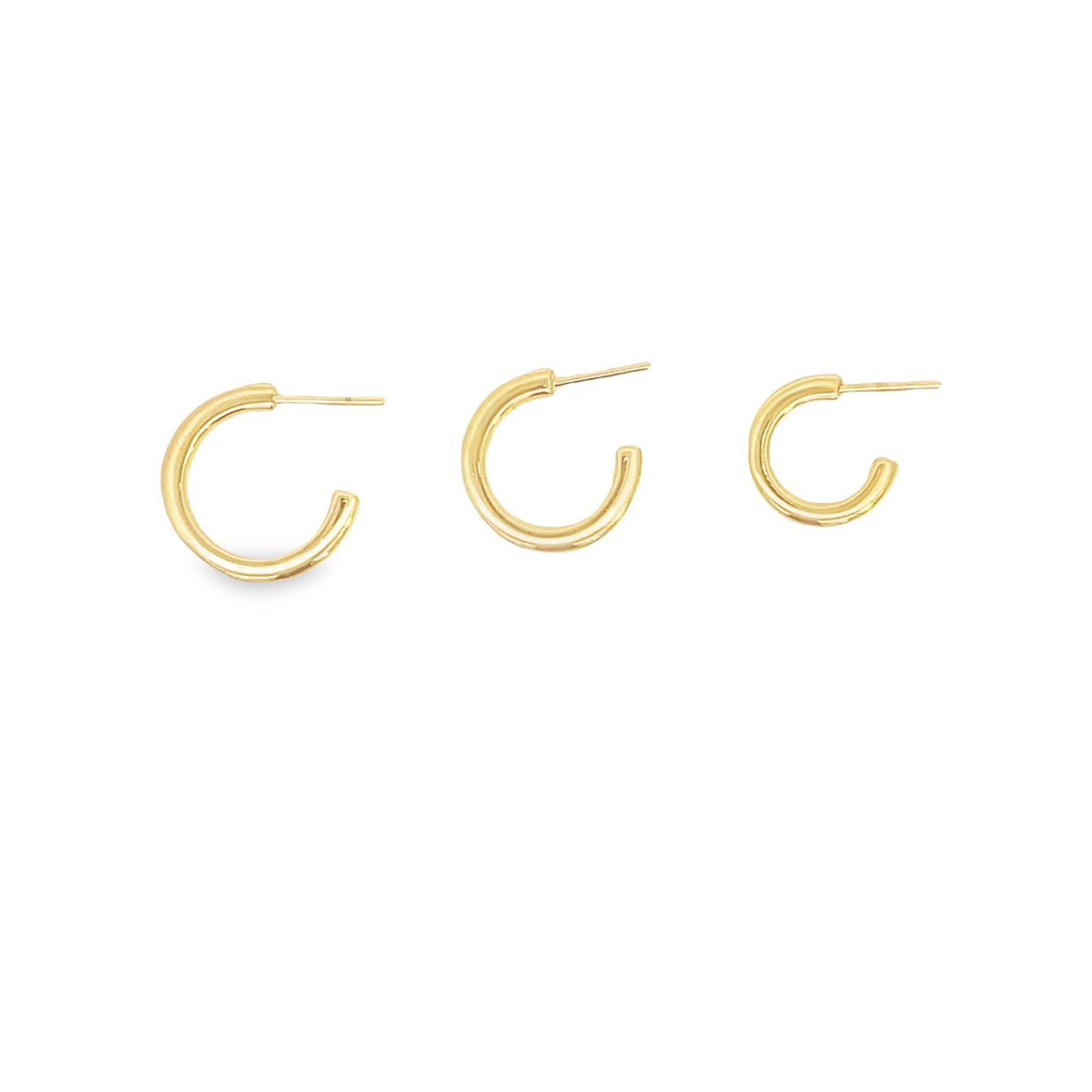 Three polished gold hoop earrings in graduated sizes display their posts against a clean white background.