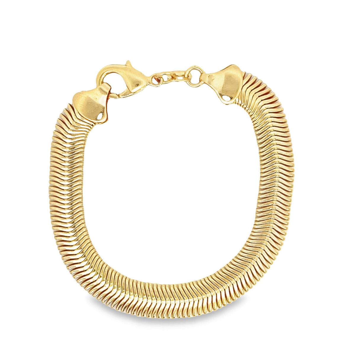 A thick, gold-plated herringbone chain bracelet curves gracefully against a plain white background, secured with a classic lobster clasp.