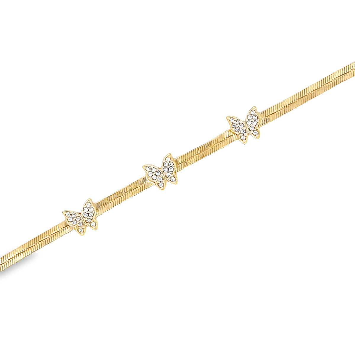 A delicate gold herringbone chain bracelet features three crystal-studded butterfly charms set against a clean white background.