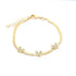 A gold herringbone chain bracelet features three sparkling crystal-embellished butterfly charms and an adjustable extension clasp against a clean white background.