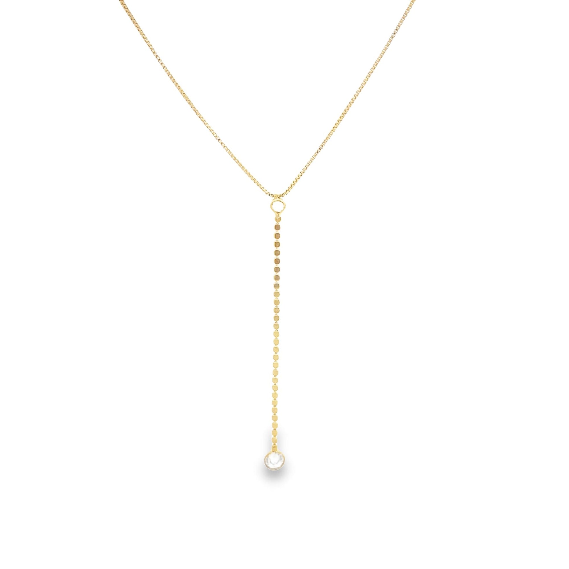 A delicate gold lariat necklace featuring a dangling coin chain with a sparkling diamond pendant on a white background.