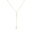 A delicate gold lariat necklace featuring a dangling coin chain with a sparkling diamond pendant on a white background.