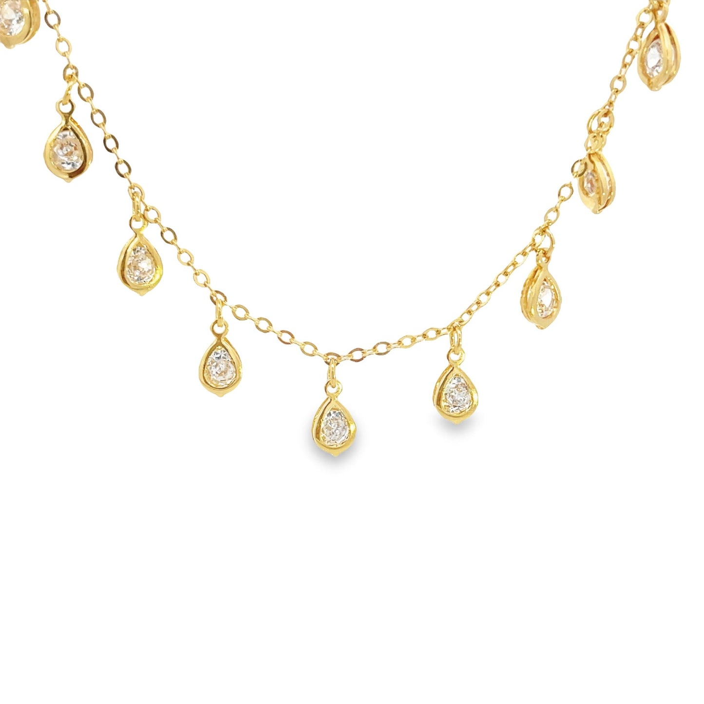A delicate gold chain necklace features sparkling teardrop charms dangling gracefully against a white background.