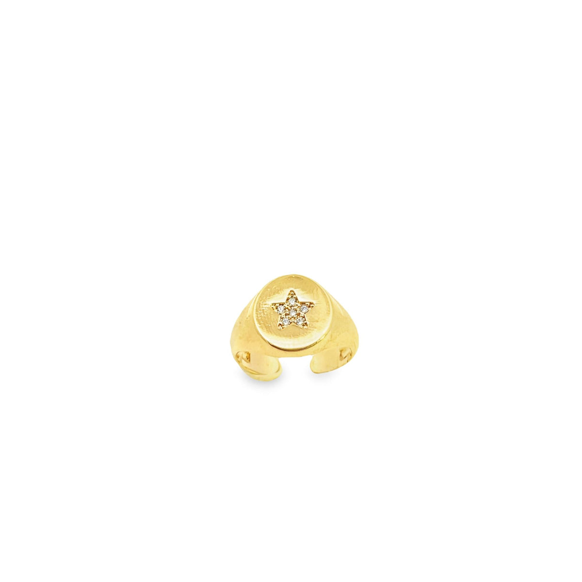 A gold signet ear cuff features a sparkly diamond-studded star on its face.