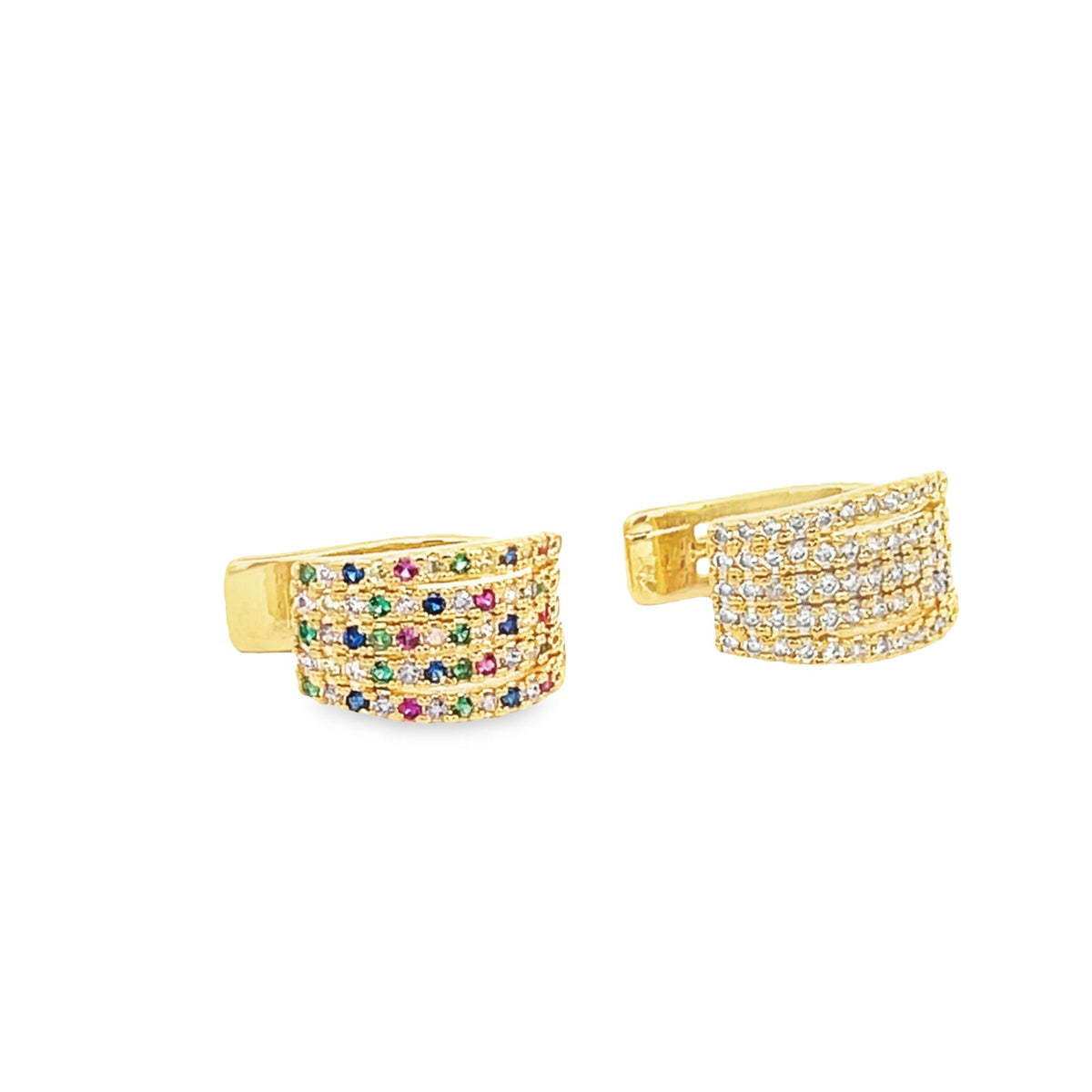 A pair of gold huggie hoop earrings features rows of sparkling multicolored gemstones against a clean white background.