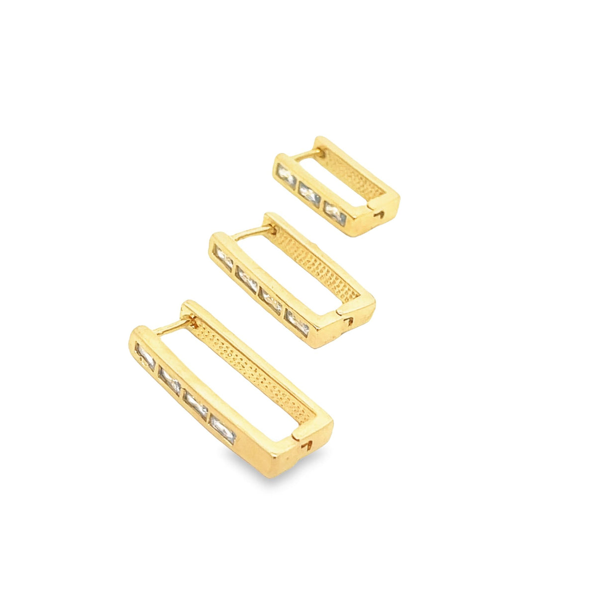 A graduating set of three rectangular gold hoop earrings features sparkling baguette-cut zirconia stones set along the edges.