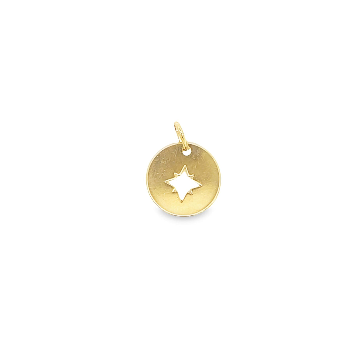 A round gold pendant features a cut-out star shape in the center against a clean white background.
