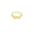 A delicate gold double-band ring features a sparkling bow detail accented with tiny crystals against a plain white background.