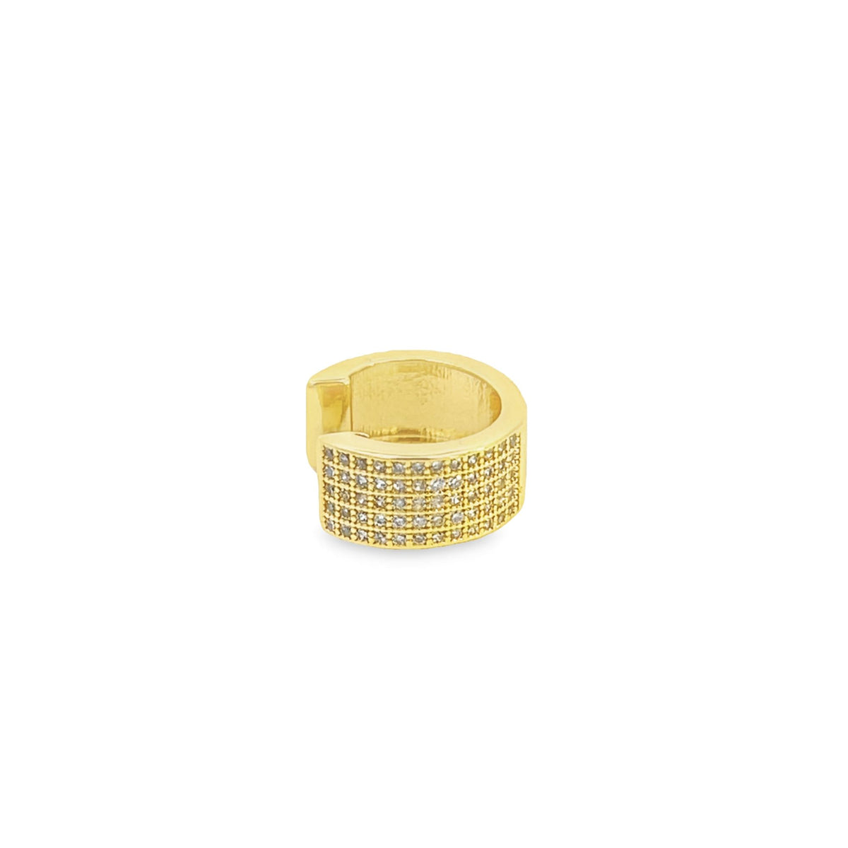 A gold ear cuff sparkles with multiple rows of tiny pave-set diamonds against a plain white background.