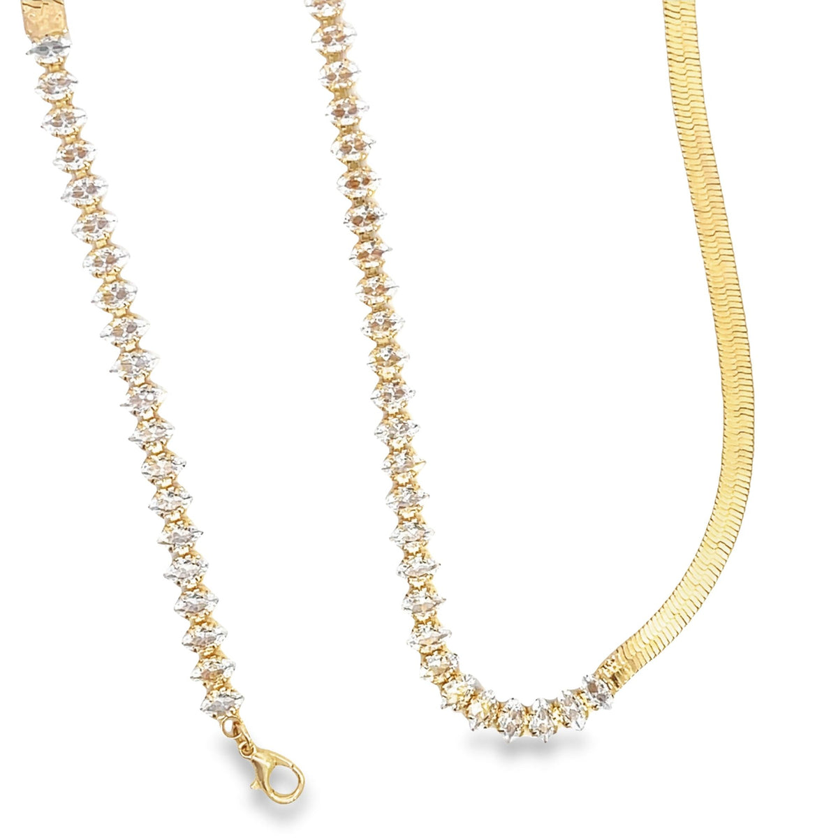 A sophisticated gold necklace combines a sparkling diamond-encrusted tennis chain section with a sleek herringbone chain against a clean white background.