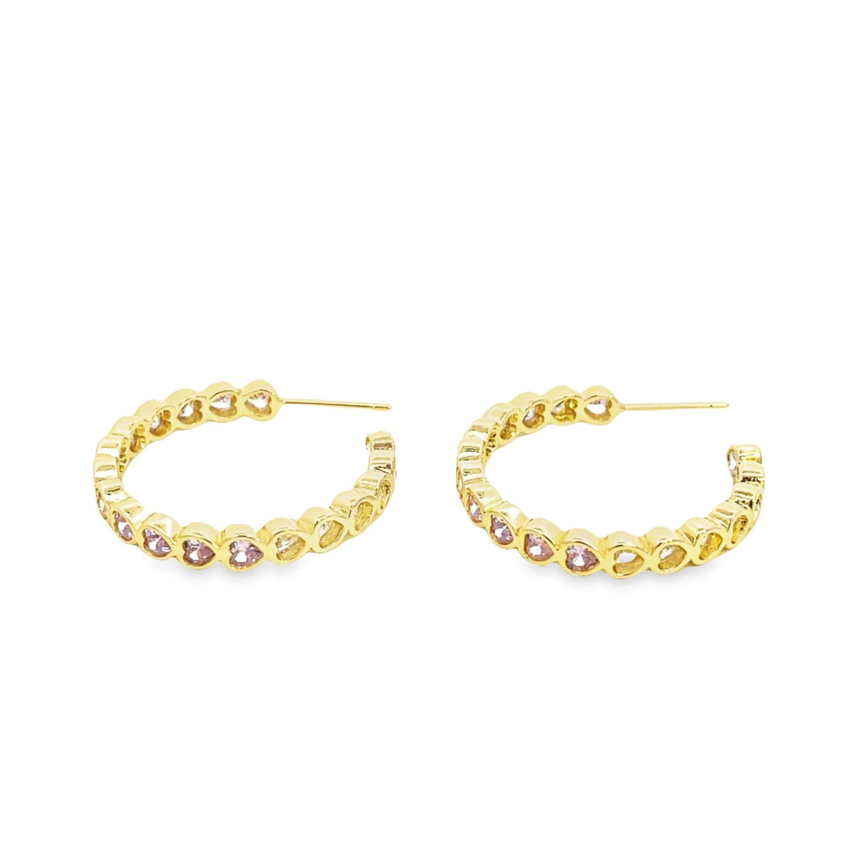 A pair of gold hoop earrings features alternating pink and yellow heart-shaped stones set against a white background.