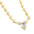 A sparkling gold necklace features a prominent pear-shaped diamond pendant and a delicate chain adorned with smaller round gemstones.