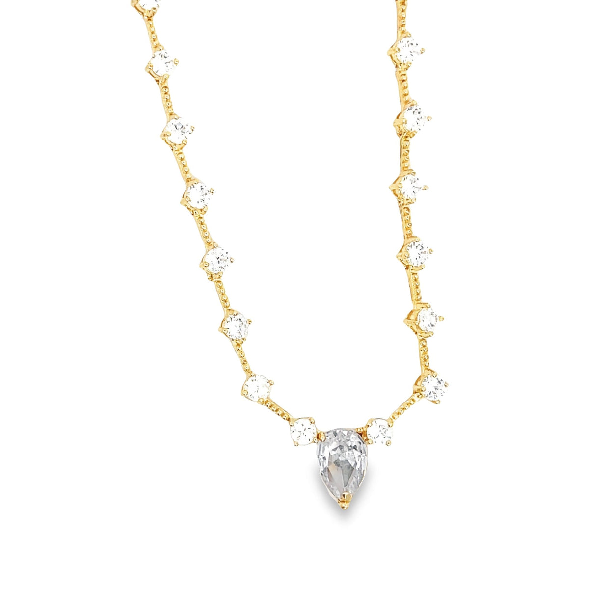 A delicate gold station necklace sparkles with round and pear-shaped cubic zirconia stones.