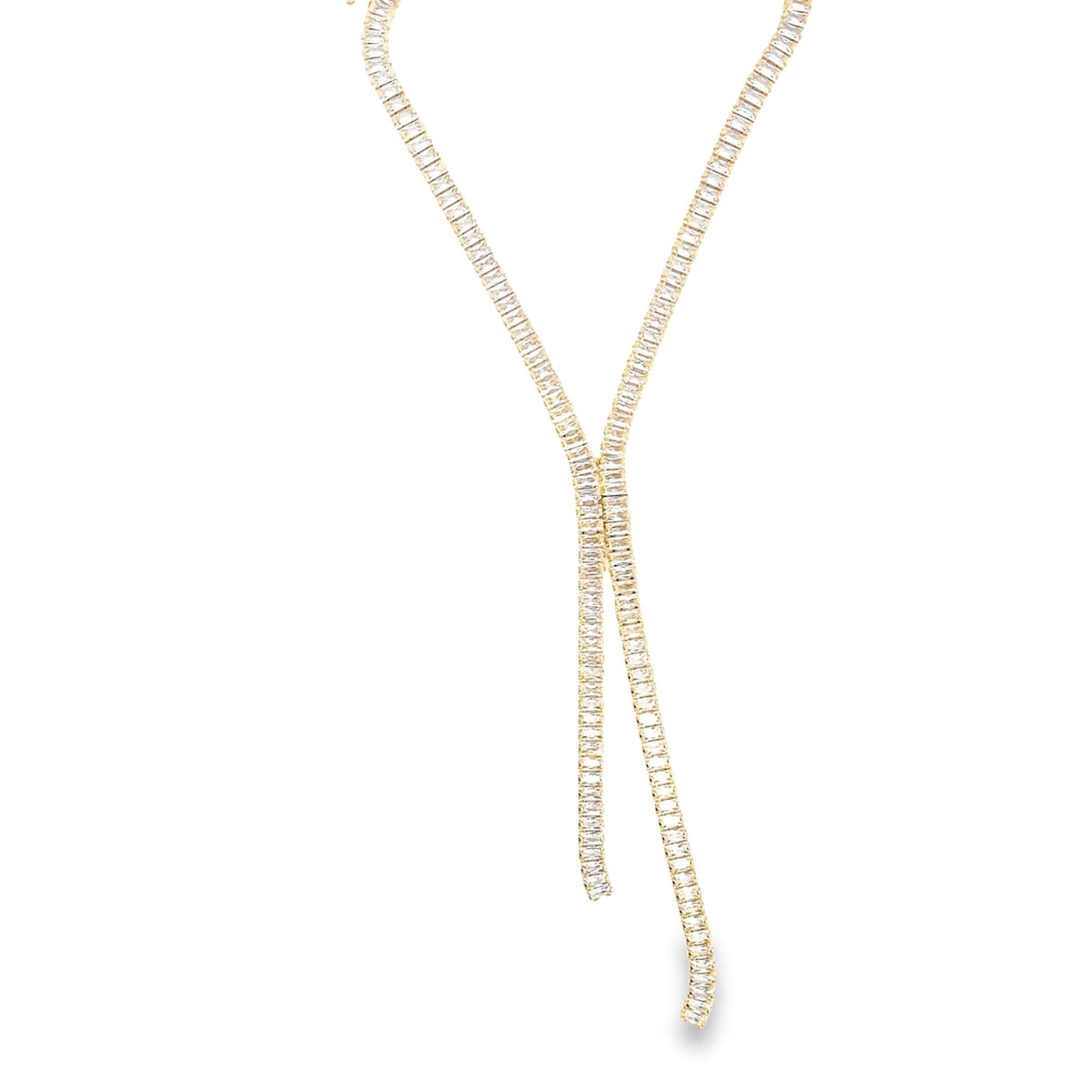 A delicate gold lariat necklace sparkles with a continuous line of rectangular cubic zirconia stones against a clean white background.