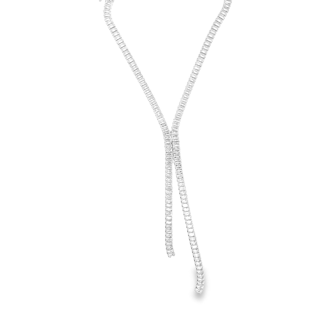 A sparkling diamond lariat necklace sparkles against a clean white background.