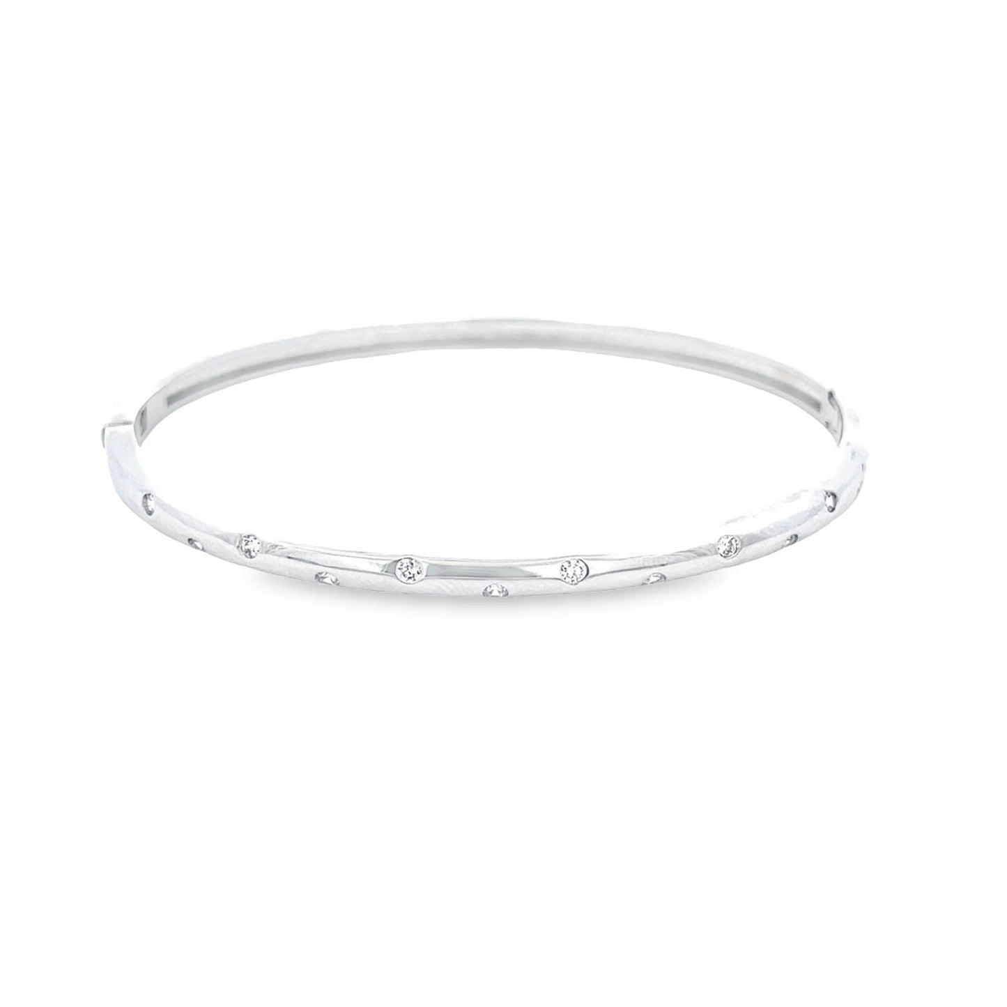 A sleek white gold bangle bracelet glimmers against a clean white background, showcasing evenly spaced sparkling diamonds flush-set along its slim band.