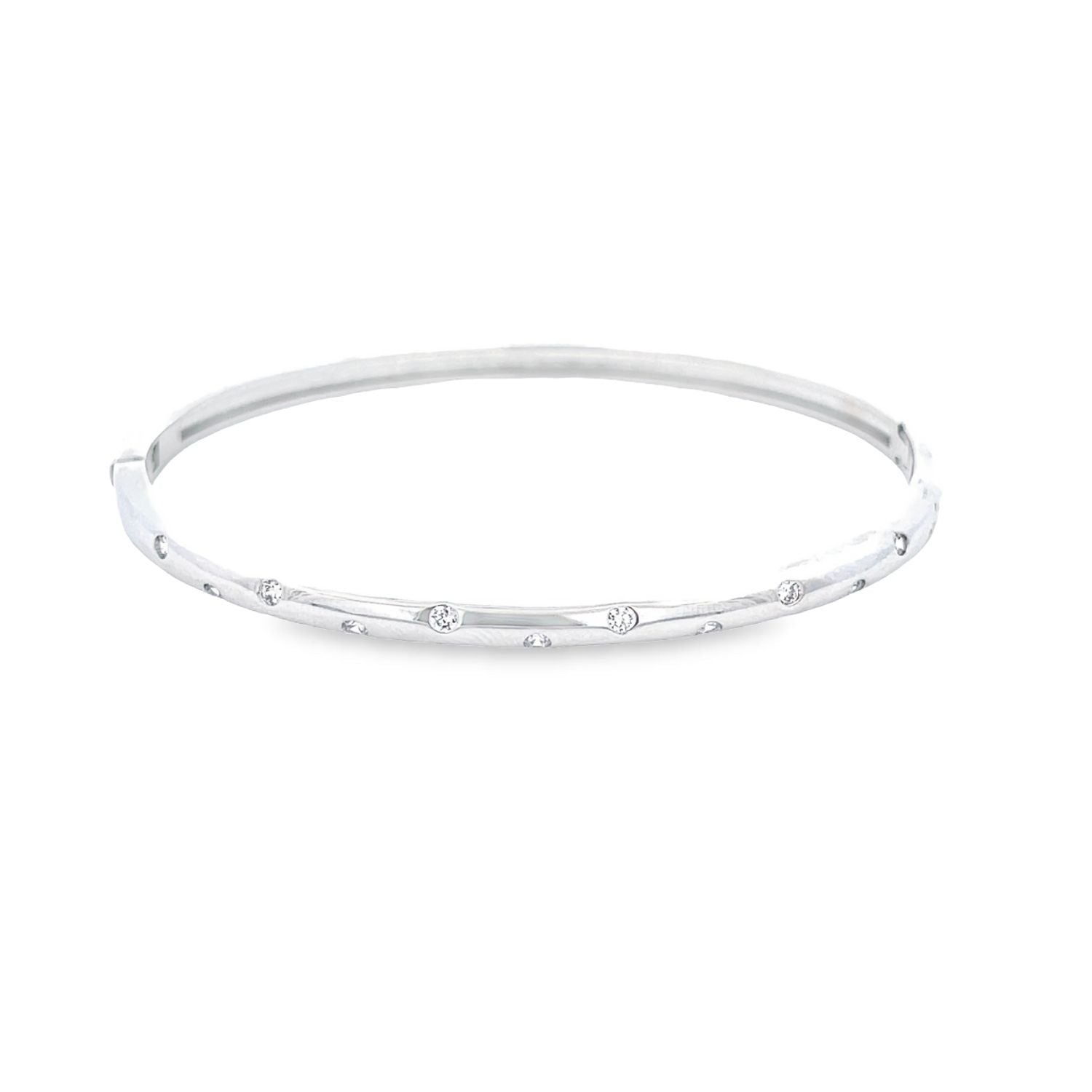 A sleek white gold bangle bracelet glimmers against a clean white background, showcasing evenly spaced sparkling diamonds flush-set along its slim band.