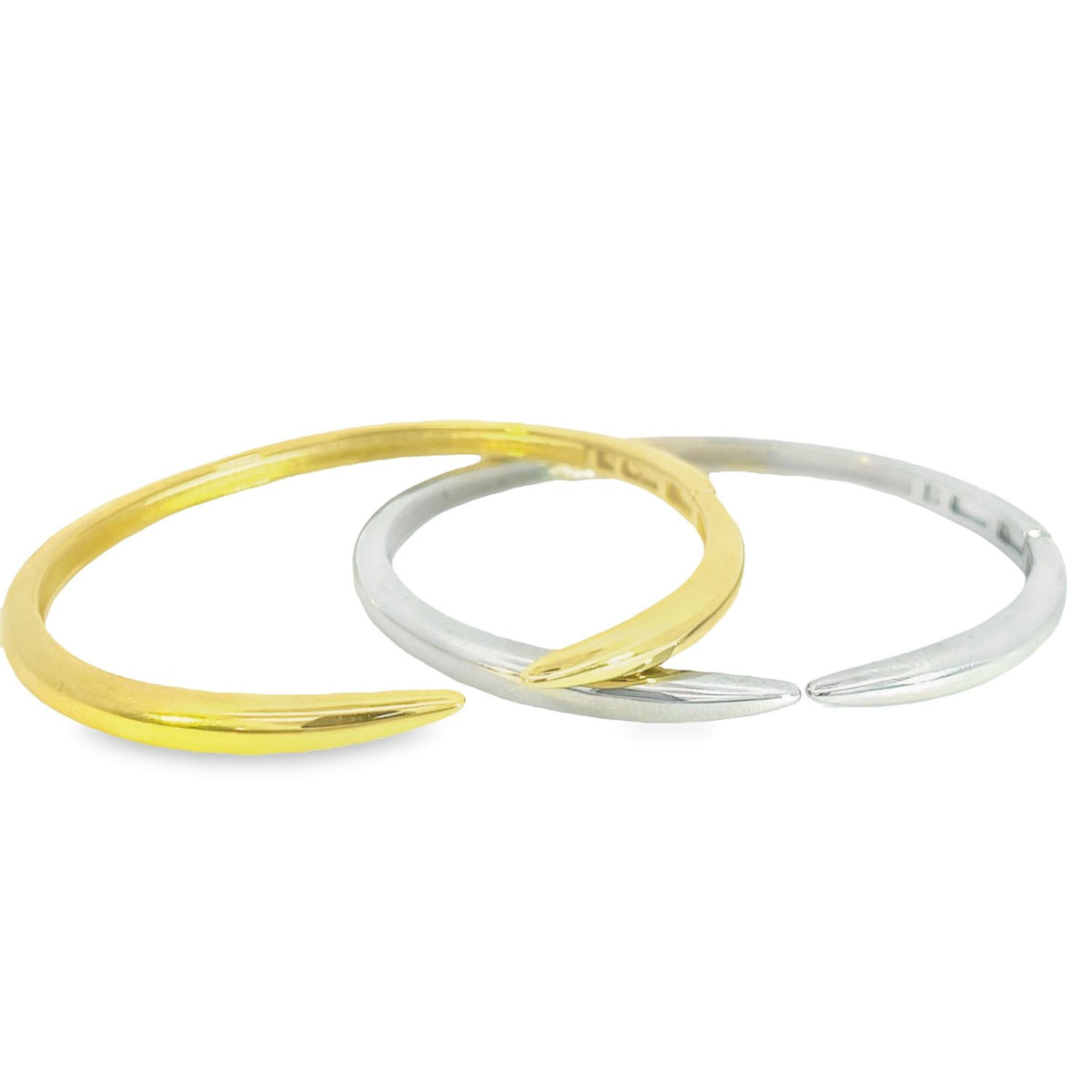 A gold claw ring and a silver claw ring lie side by side on a clean white background.
