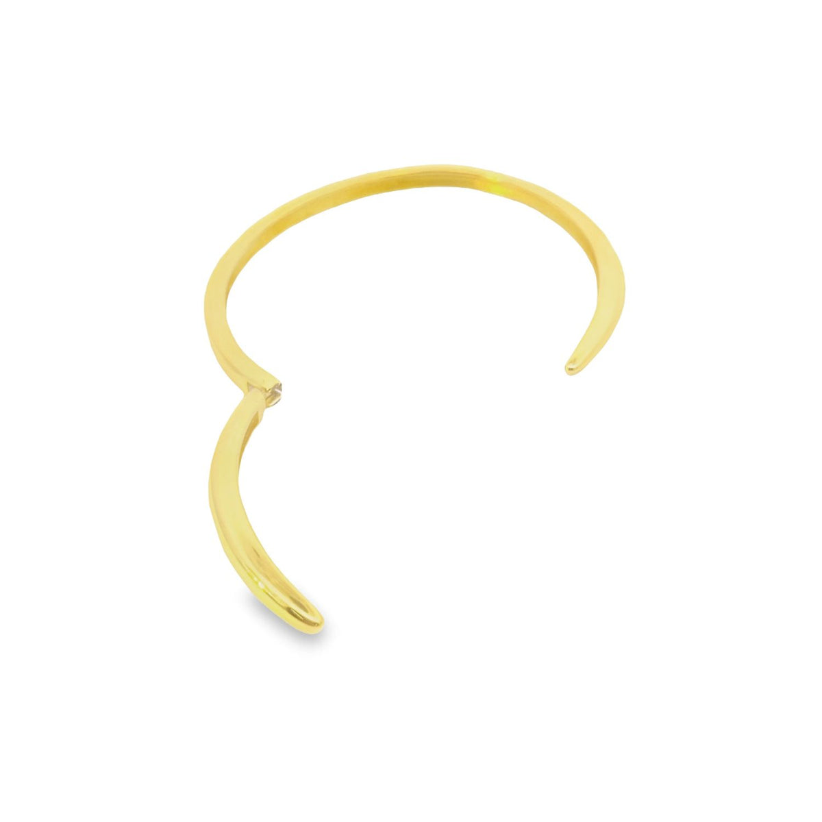 A minimalist gold hinged clicker hoop earring curves gracefully against a clean white background.