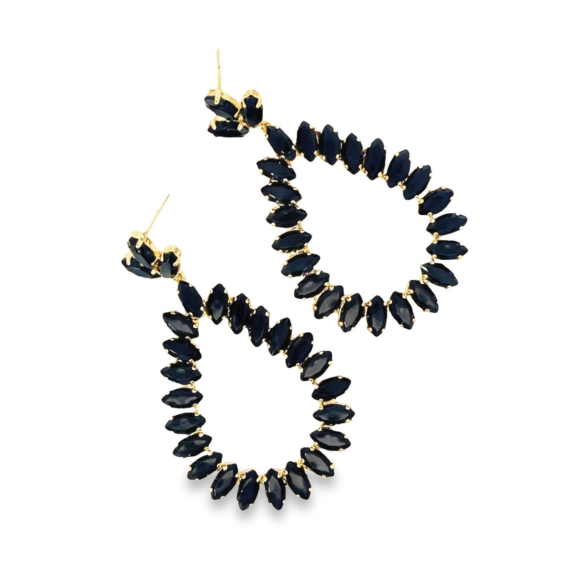 A pair of elegant teardrop-shaped dangle earrings features dark marquise-cut navy blue stones set in gold against a clean white background.